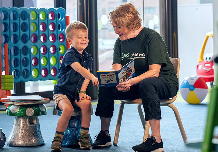 Women reading to child in kidzone