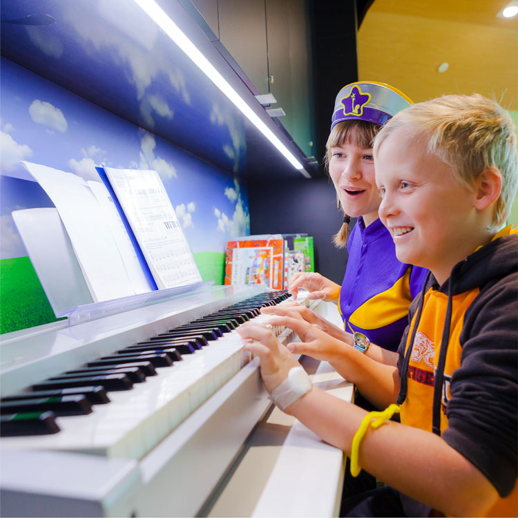 Young boy playing piano
