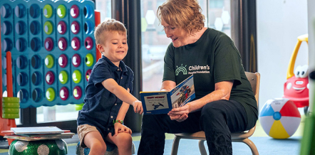 Image of kids ands staff celebrating a birthday