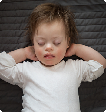 Sleeping child with Down Syndrome
