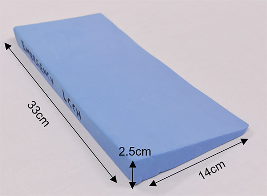 Thoracic elevation device (TED) dimensions (height is 2.5cm, width is 14cm, length is 33cm)