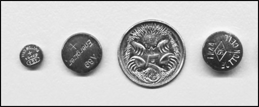 Three button batteries and an Australian five cent coin